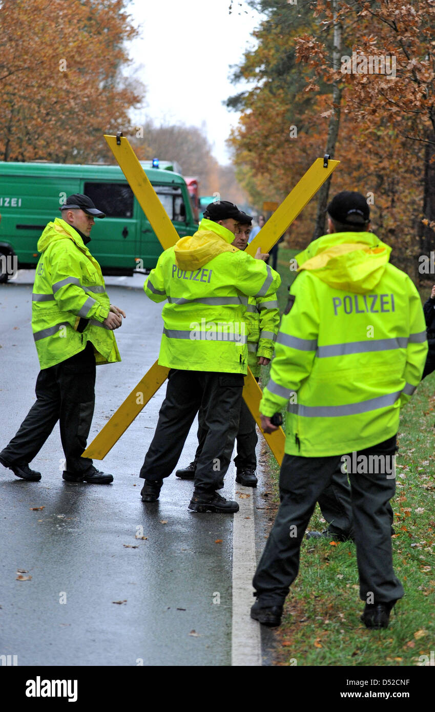 Police officers prepare for protests against CASTOR transport in Klein Gusborn, Germany, 04 November 2010. Eleven containers with nuclear waste from nuclear fuel reprocessing plant La Hague are to arrive on 05 November 2010 in Gorleben. A protest that has not been seen in a long time against the CASTOR transport is expected. Photo: Philipp Schulze Stock Photo