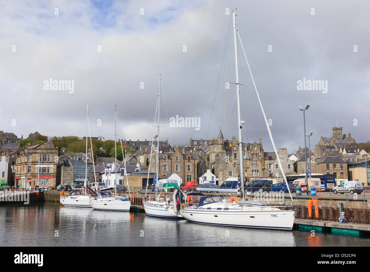 Yachts moored in small boat harbour with old town waterfront buildings in Lerwick, Mainland Shetland Islands, Scotland, UK Stock Photo