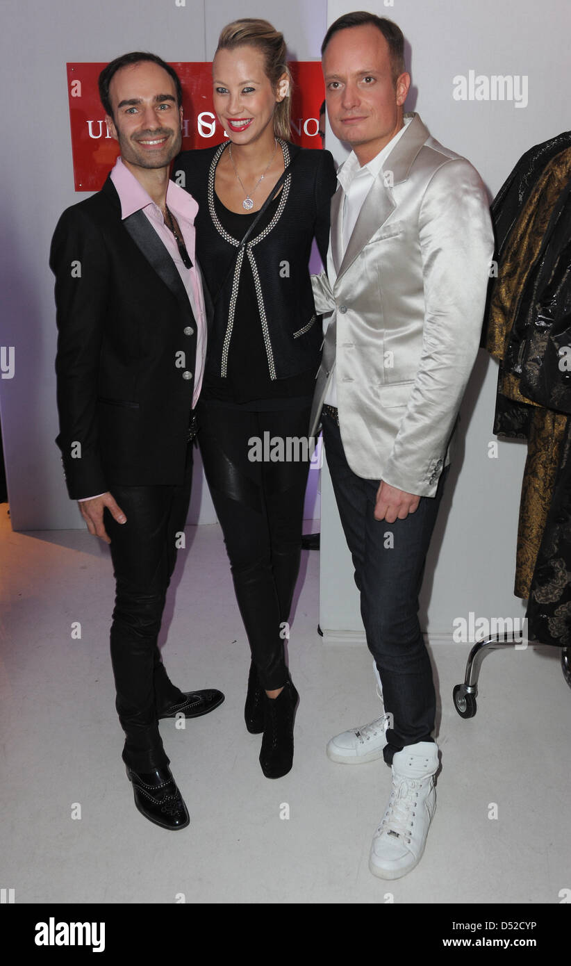 Alessandra Pocher (C) smiles with fashion designers Klaus Unrath (R) and Ivan Strano (L) during their fashion label's trunkshow in Cologne, Germany, 04 November 2010. Photo: Joerg Carstensen Stock Photo