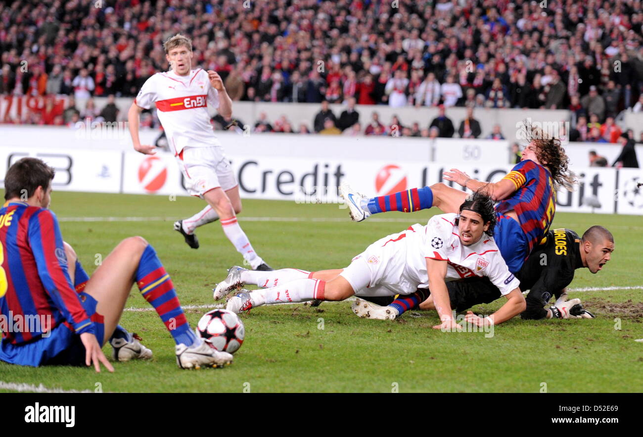 Stuttgart's Sami Khedira (C) fights for the ball with Barcelona's Victor Valdes (R-L), Carles Puyol and Gerard Piqué during the Champions League last 16 first leg match VfB Stuttgart vs FC Barcelona at Mercedes-Benz Arena stadium in Stuttgart, Germany, 23 February 2010. The match between German Bundesliga club Stuttgart and Spanish side Barcelona ended in a 1-1 draw. Photo: Bernd W Stock Photo