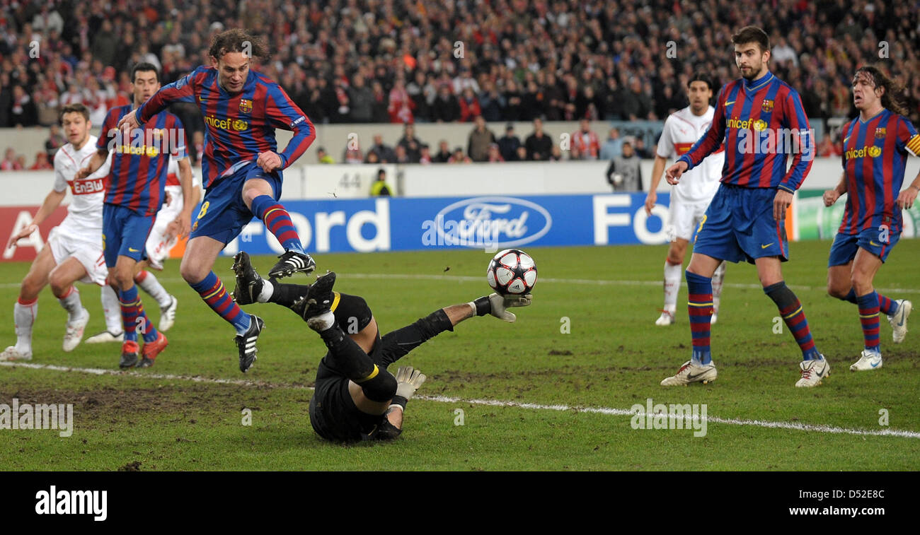 Barcelona's goalkeeper Victor Valdes (bottom) and Gabriel Milito (3-L) shown in action during the Champions League last 16 first leg match VfB Stuttgart vs FC Barcelona at Mercedes-Benz Arena stadium in Stuttgart, Germany, 23 February 2010. The match between German Bundesliga club Stuttgart and Spanish side Barcelona ended in a 1-1 draw. Photo: Ronald Wittek Stock Photo