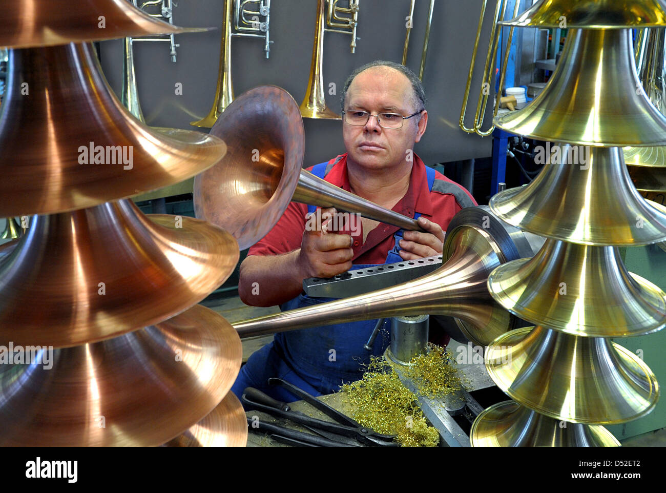 Instrument master builder Juergen Voigt manufactures premium brass instruments in his workshop in Markneukirchen, Germany, 16 February 2010. The Vogtland region has been for more than 350 years a worldwide unique area with high-class instrument master builders in and around Markneukirchen and Klingenthal. Photo: Wolfgang Thieme Stock Photo