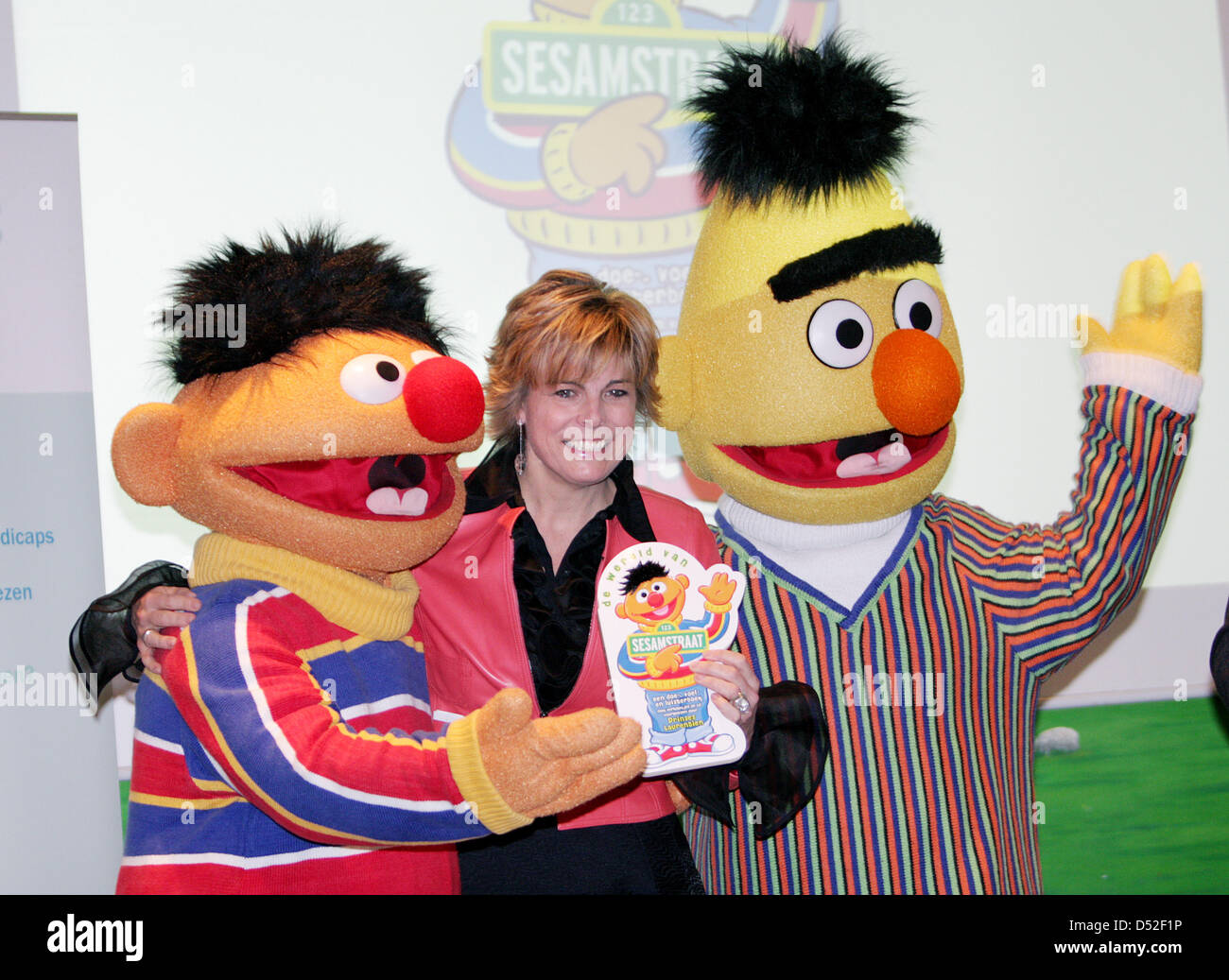 Princess Laurentien of the Netherlands (C) smiles with Sesame Street characters Ernie and Bert after she received the first copy of the book of 'The World of Sesame Street' in The Hague, the Netherlands, 25 February 2010. The Princess wrote the text of the book. This edition of Sesame Street books is the third in a sequence of books for children with a disability. Photo: Patrick va Stock Photo