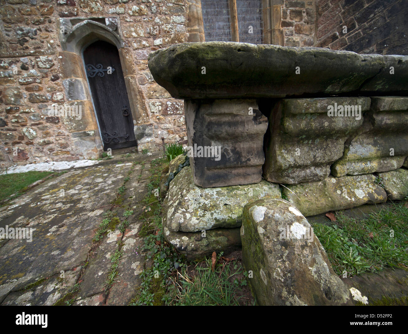 A tomb in the churchyard in the village of Brightling Stock Photo