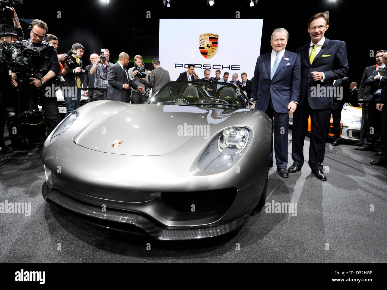 Michael Macht, CEO of Porsche AG (R), and chairman of the supervisory