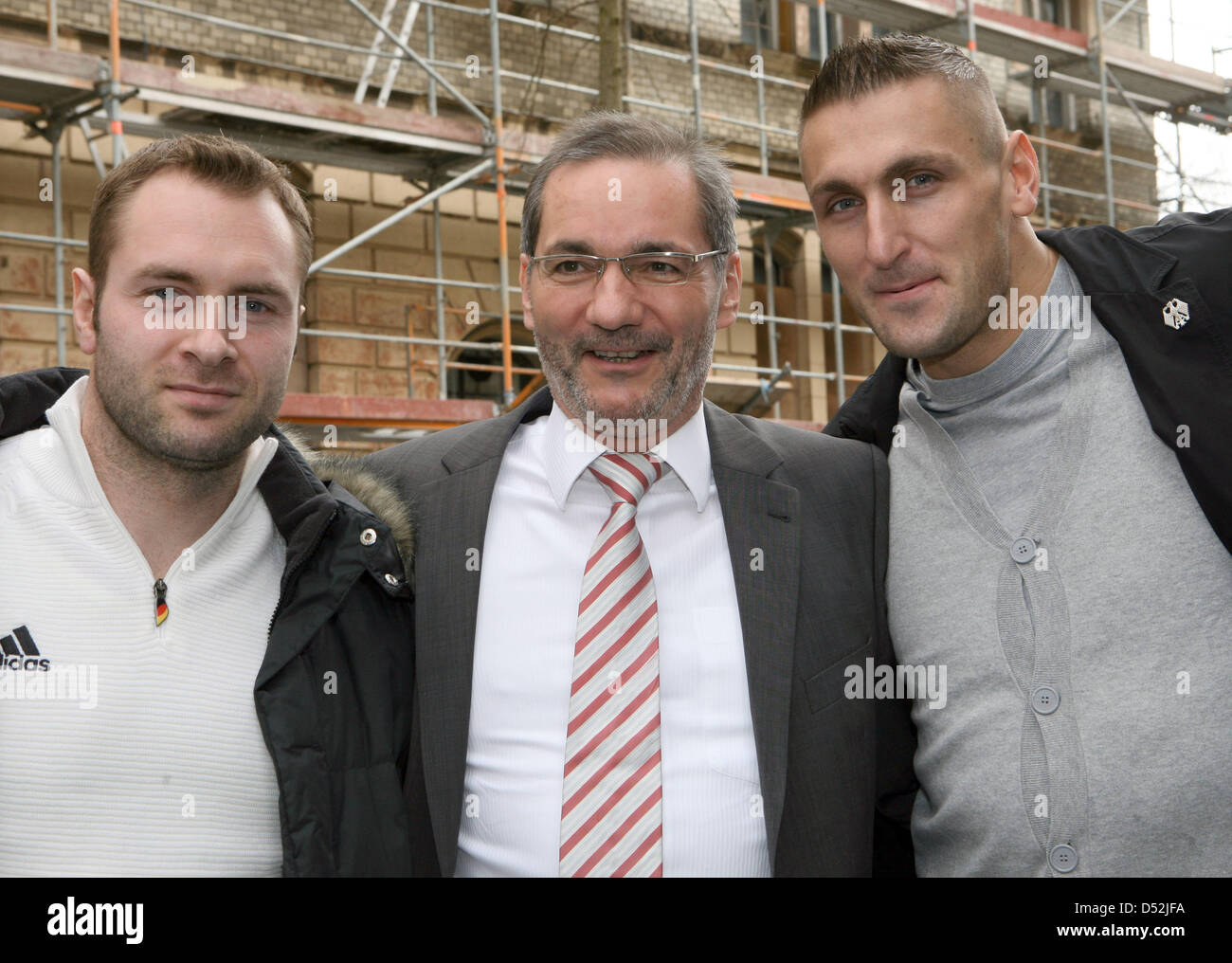 Brandenburg's Prime Minister Matthias Platzeck (C) meets Olympic bobsleigh champion Kevin Kuske (R) and bobsleigh team member Andreas Barucha in Potsdam, Germany, 03 March 2010. Pusher Kuske won the gold medal in the two-men bobsleigh event and the silver medal in the four-men event with pilot Andre Lange (not depicted), Barucha finihsed fourth in the four-men bobsleigh Germany II  Stock Photo