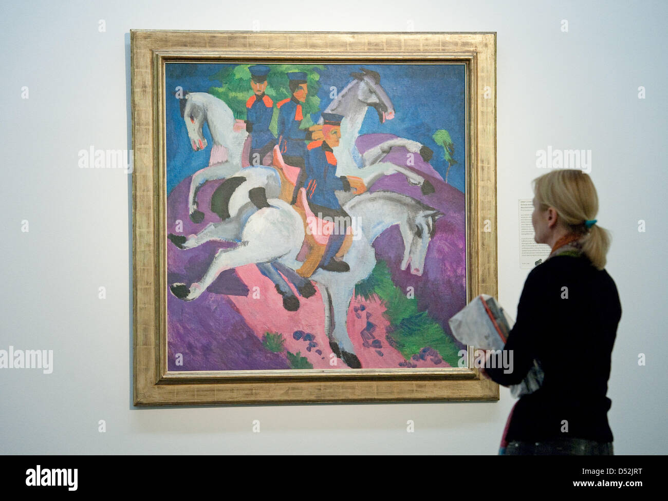 A woman looks at the painting 'Riding Artillerymen' by artist Ernst Ludwig Kirchner in the exhibition 'Bruecke Bauhaus Blaue Reiter - Treasures from the Max Fischer Collection' at the 'Staatsgalerie' ('State Gallery') in Stuttgart, Germany, 04 March 2010. The exhibition is open from 05 March to 20 June 2010 and features about 180 works of art from the private collection of the entr Stock Photo