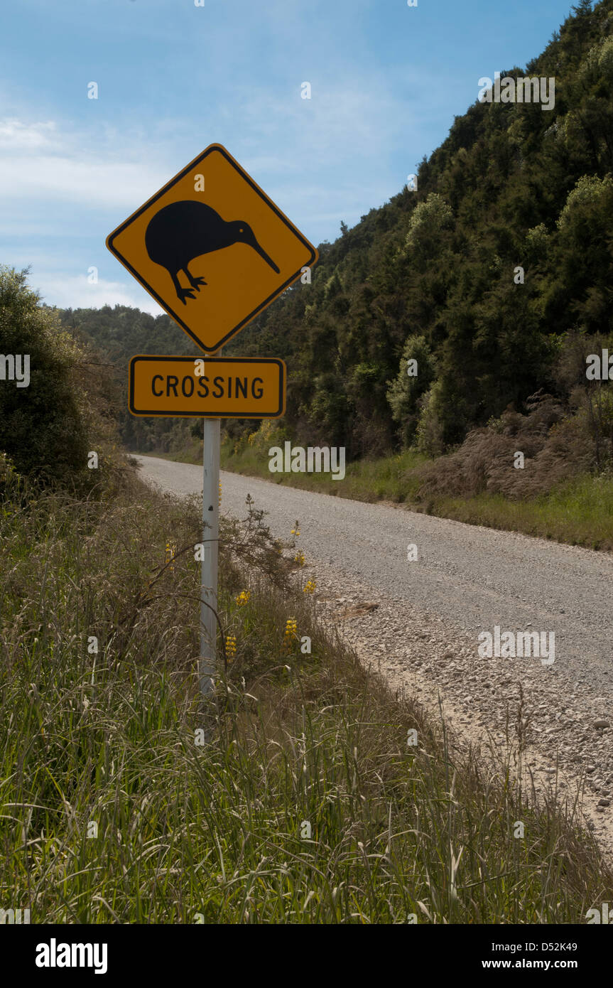 Sometimes traffic signs in New Zealand warn drivers Kiwi birds could cross the road.  Achtung: Kiwi-Vögel kreuzen Stock Photo