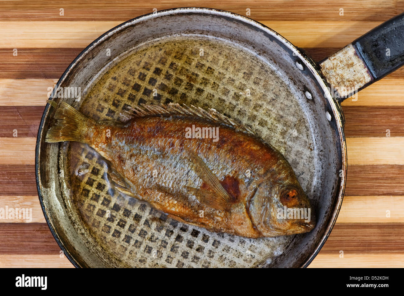 roasted fish on fried pan Stock Photo