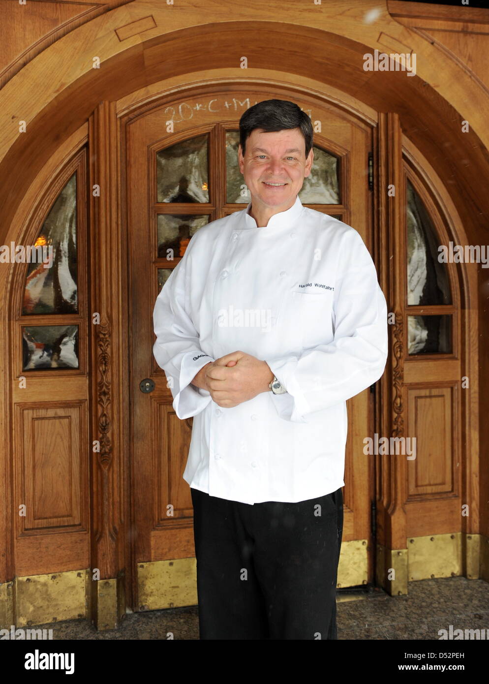 Three star cook Harald Wohlfahrt, considered to be Germany's best cook in the last years, stands in front of the entrance to 'Schwarzwaldstube' restaurant in Baiersbronn-Tonbach, Germany, 05 March 2010. Wohlfahrt is chef of Schwarzwaldstube since 1980. He received his third Michelin star in 1992. Photo: Bernd Weissbrod Stock Photo