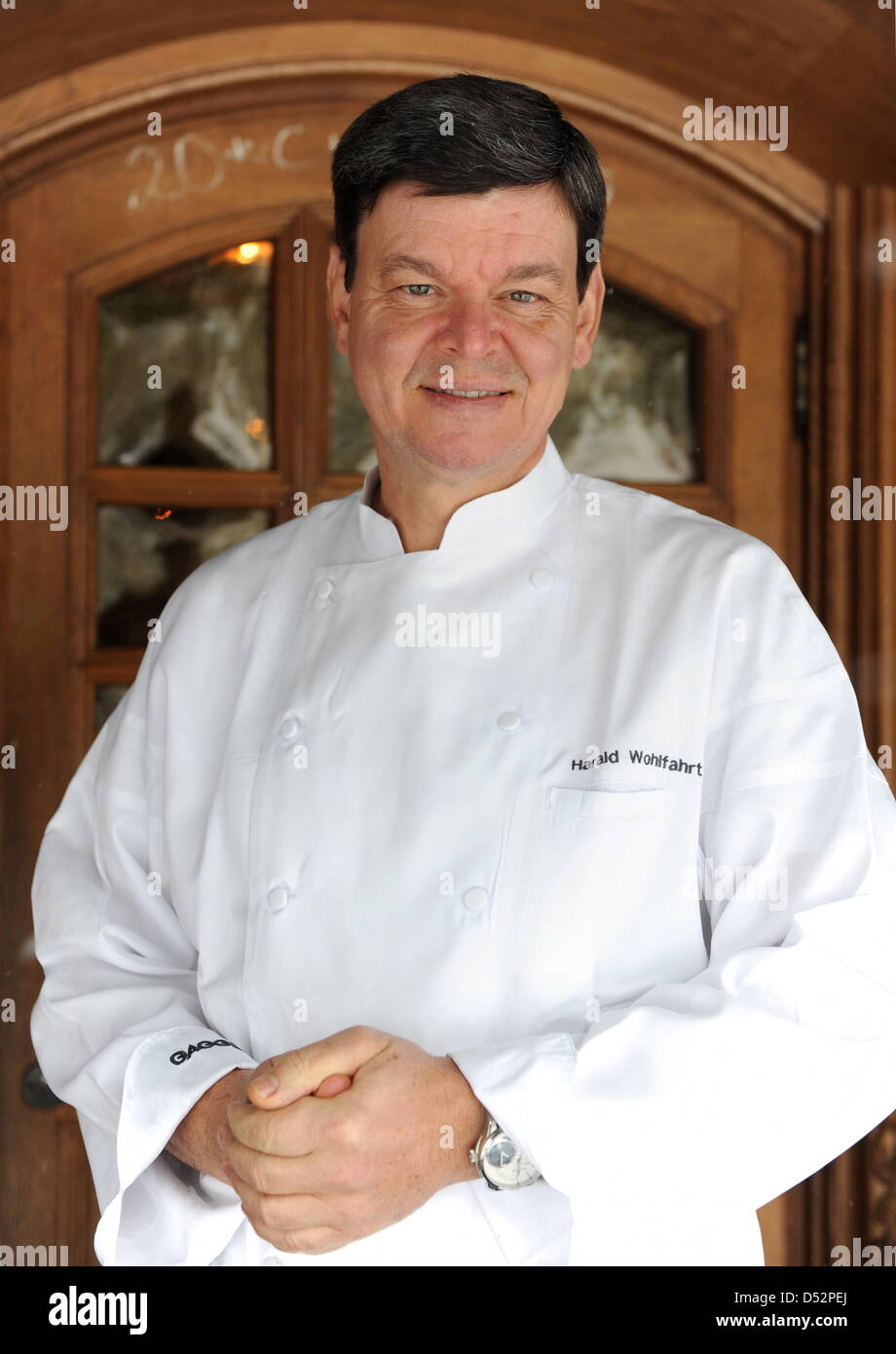 Three star cook Harald Wohlfahrt, considered to be Germany's best cook in the last years, stands in front of the entrance to 'Schwarzwaldstube' restaurant in Baiersbronn-Tonbach, Germany, 05 March 2010. Wohlfahrt is chef of Schwarzwaldstube since 1980. He received his third Michelin star in 1992. Photo: Bernd Weissbrod Stock Photo