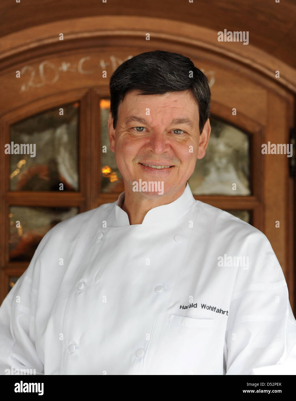 Three star cook Harald Wohlfahrt, considered to be Germany's best cook in the last years, stands in front of the entrance to 'Schwarzwaldstube' restaurant in Baiersbronn-Tonbach, Germany, 05 March 2010. Wohlfahrt is chef of Schwarzwaldstube since 1980. He received his third Michelin star in 1992. Photo: Bernd Weissbrod Stock Photo