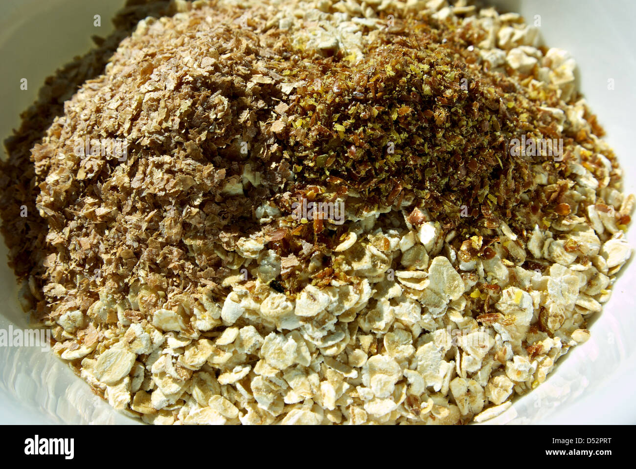 Uncooked bowl of whole grain oatmeal high fiber cereal no sodium