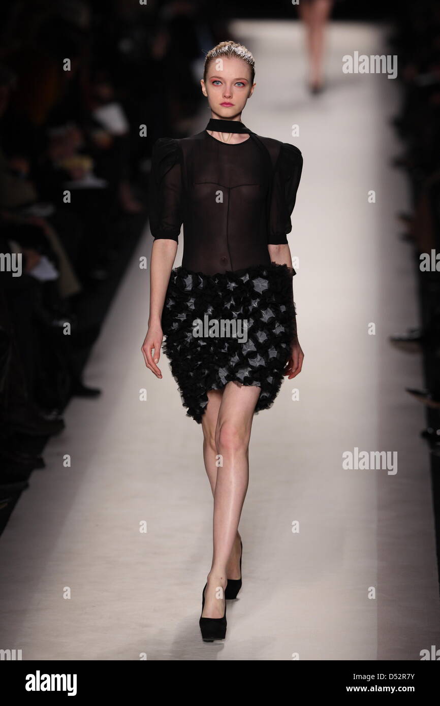 Models wear a creation as part of Yves Saint Laurent women's fashion ...
