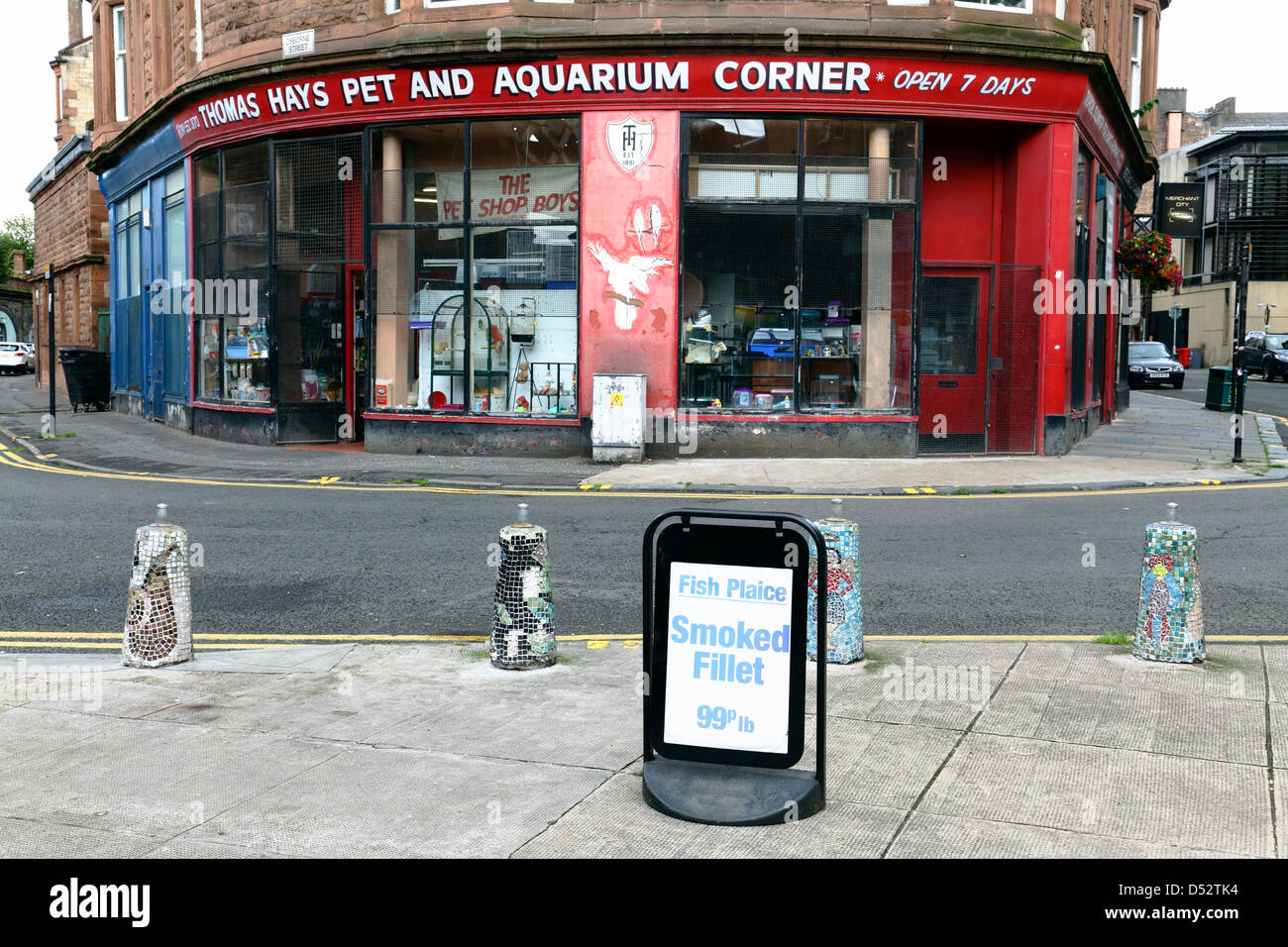 An unfortunately placed sign advertising filleted fish in front of a