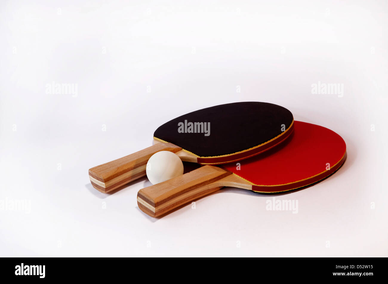 Table tennis bats with ball in red and black with wooden varnished