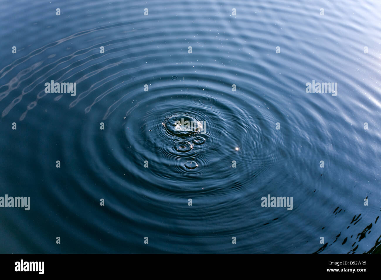 Water Droplets and Ripples Stock Photo