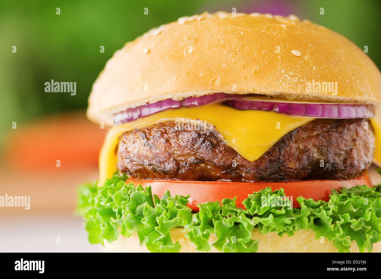appetizing cheeseburger with red onion closeup Stock Photo