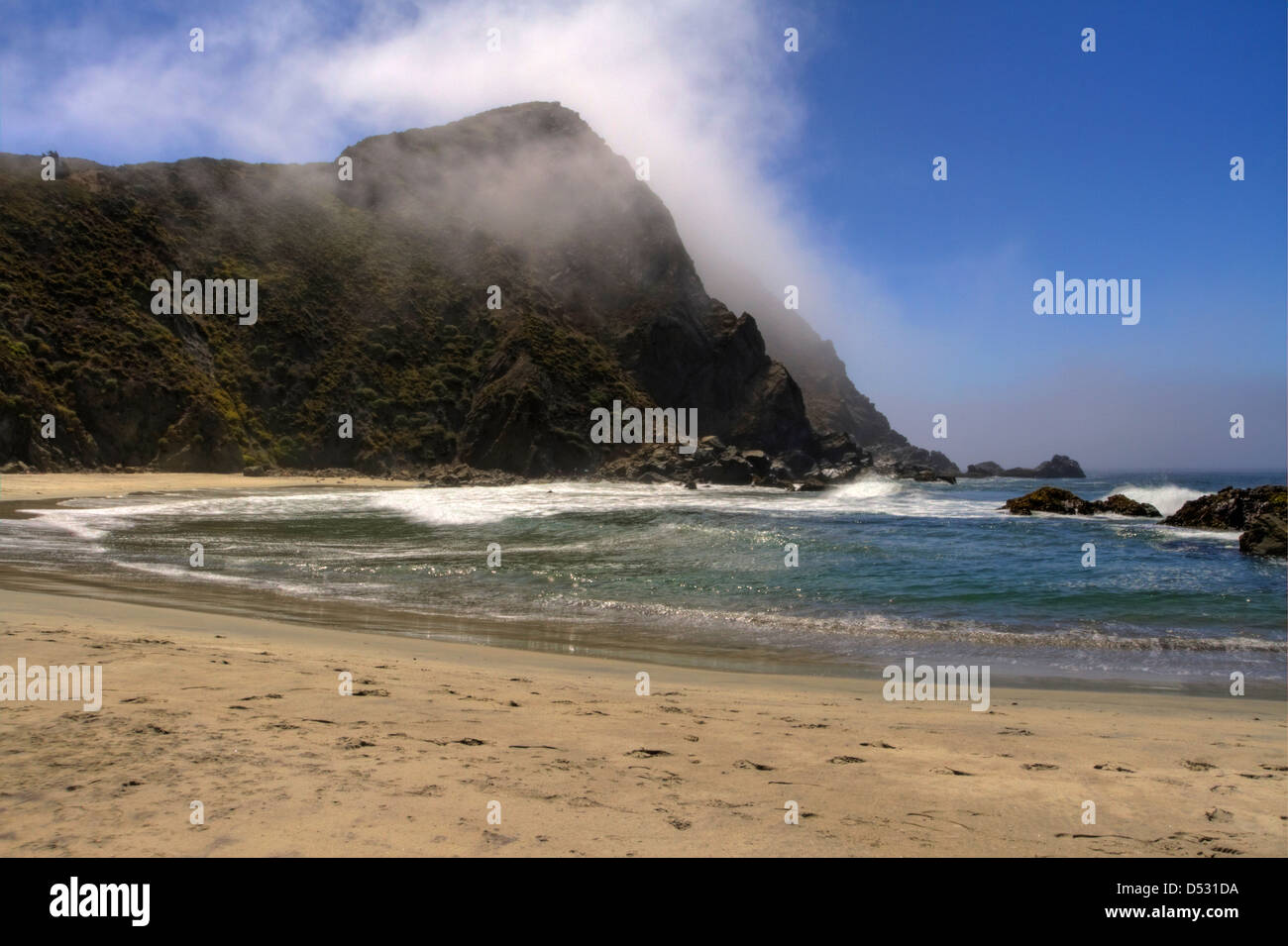 Coastline &cliffs shrouded in mist at Pfeiffer Beach in the Julia Pfeiffer Big Sur State Park, California, USA in January Stock Photo