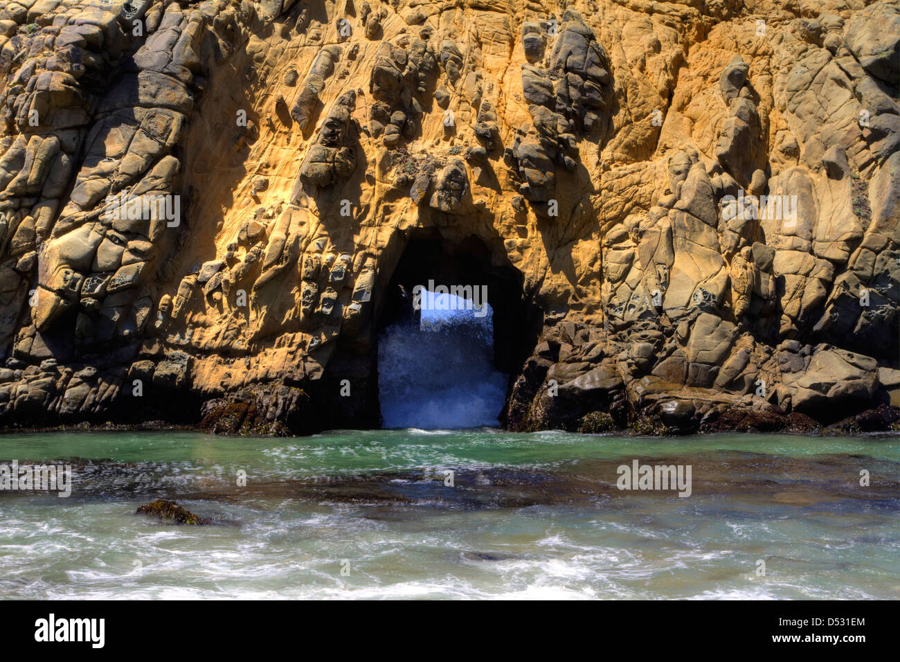 Offshore stack with an arch at Pfeiffer Beach in the Julia Pfeiffer Big Sur State Park, California, USA in January Stock Photo