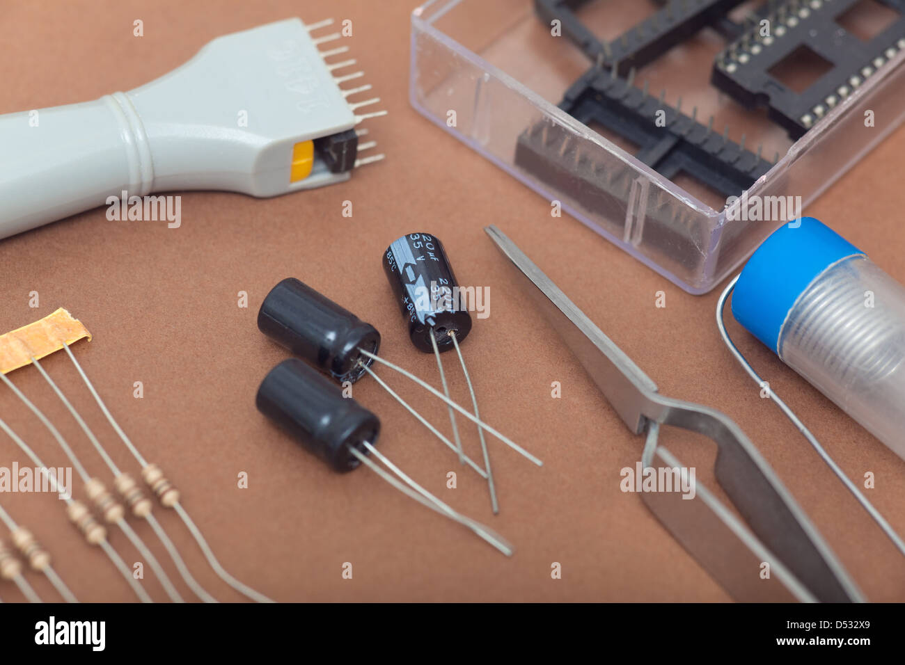 Electronic components in brown background Stock Photo - Alamy