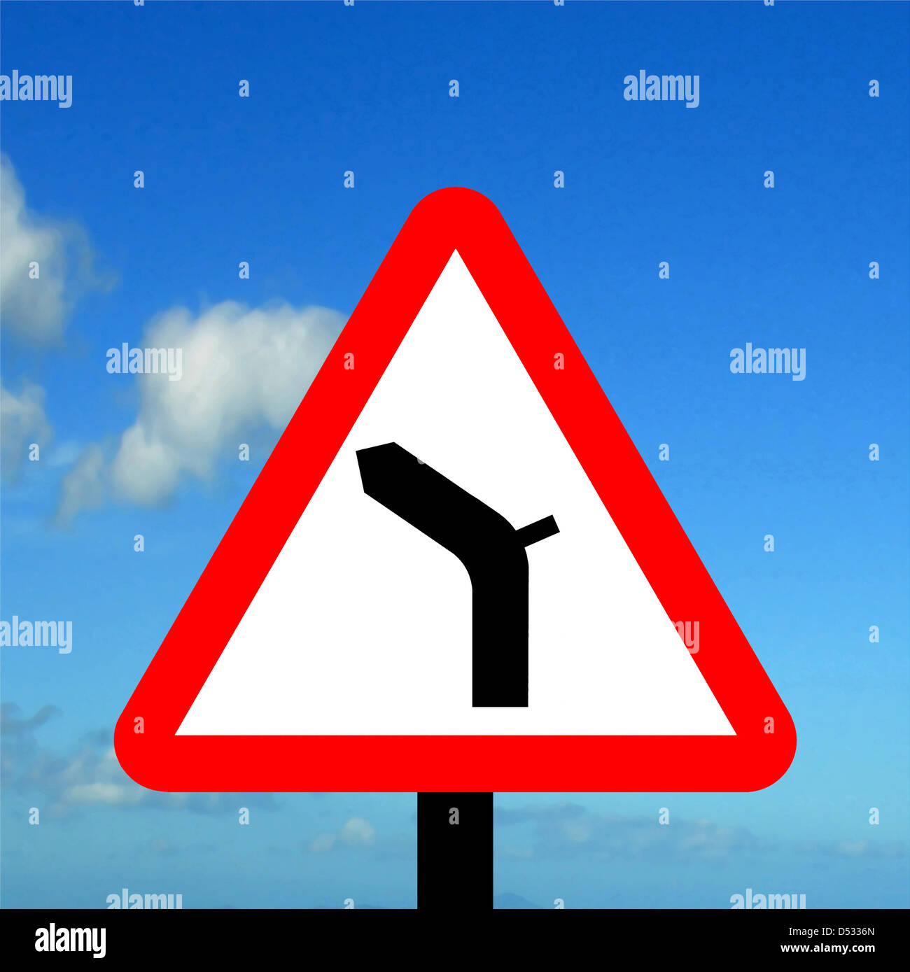 Warning triangle junction on bend to left traffic sign Stock Photo Alamy