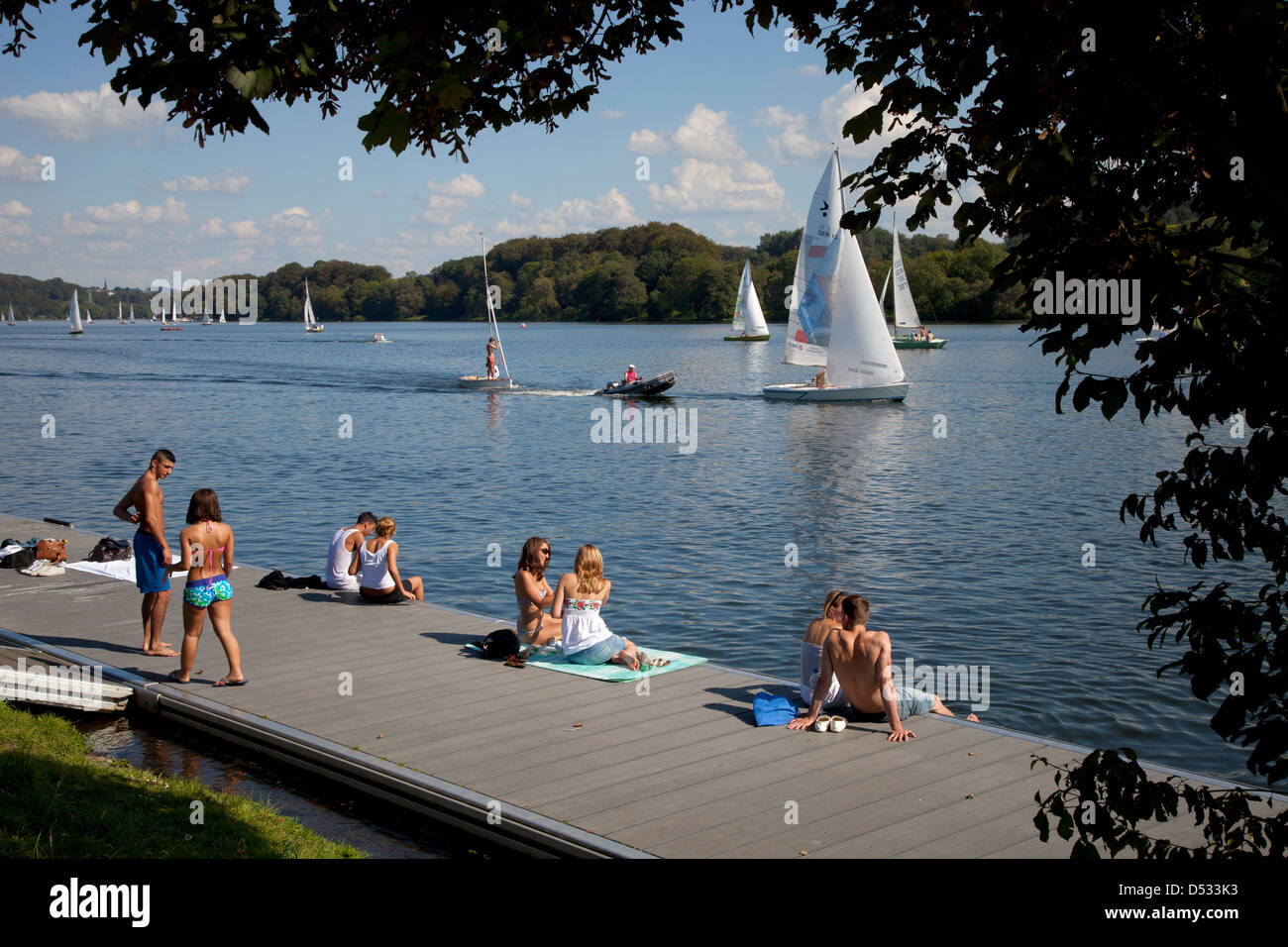 Essen, Germany, sailboats on the Baldeneysee and people at the boat dock Stock Photo