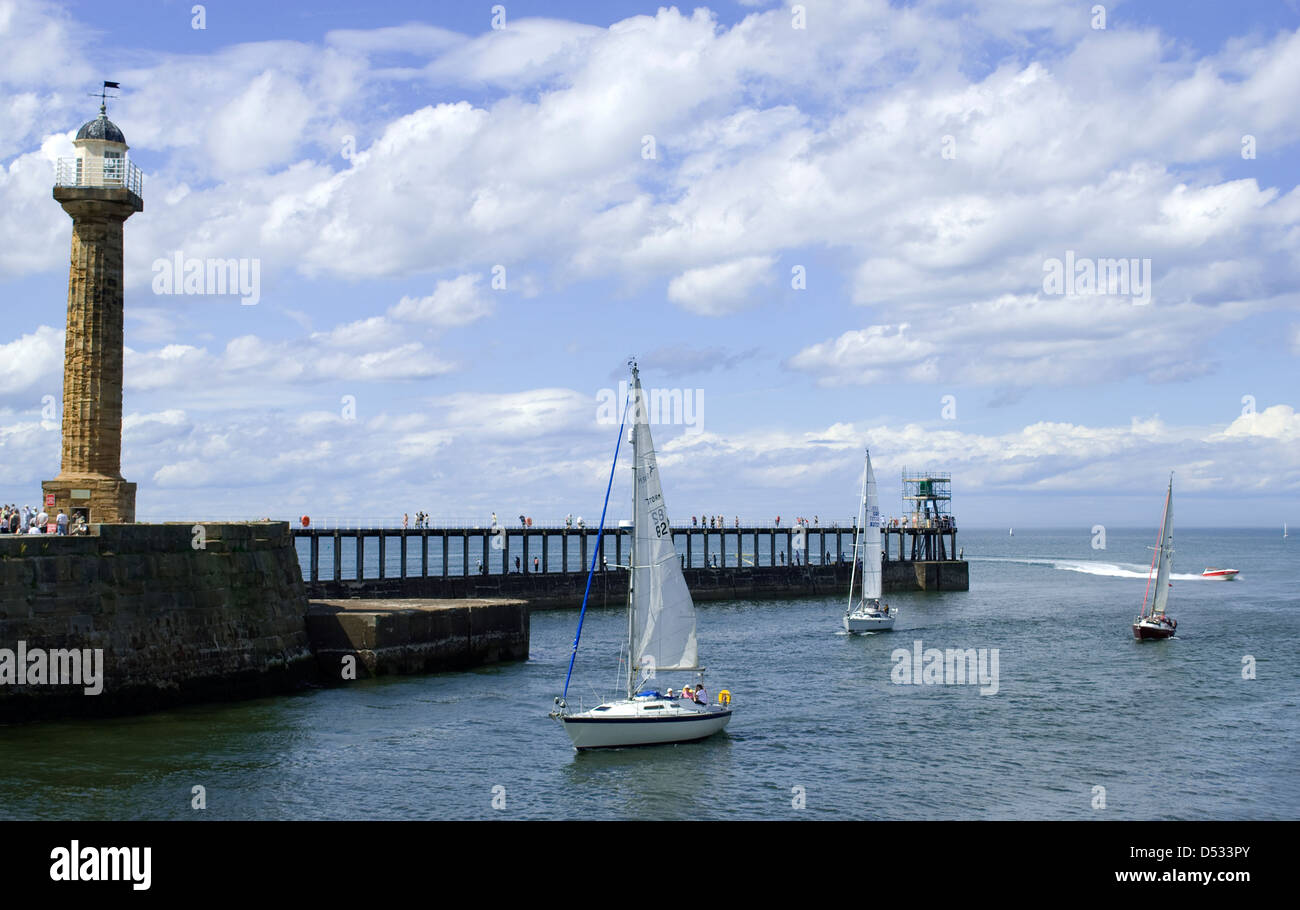 Yachts sailing into Whitby Harbour, North Yorkshire Stock Photo Alamy