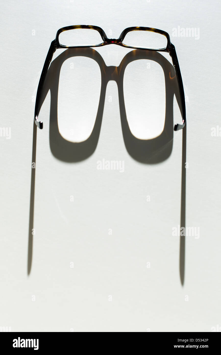 eyeglasses casting shadow Stock Photo