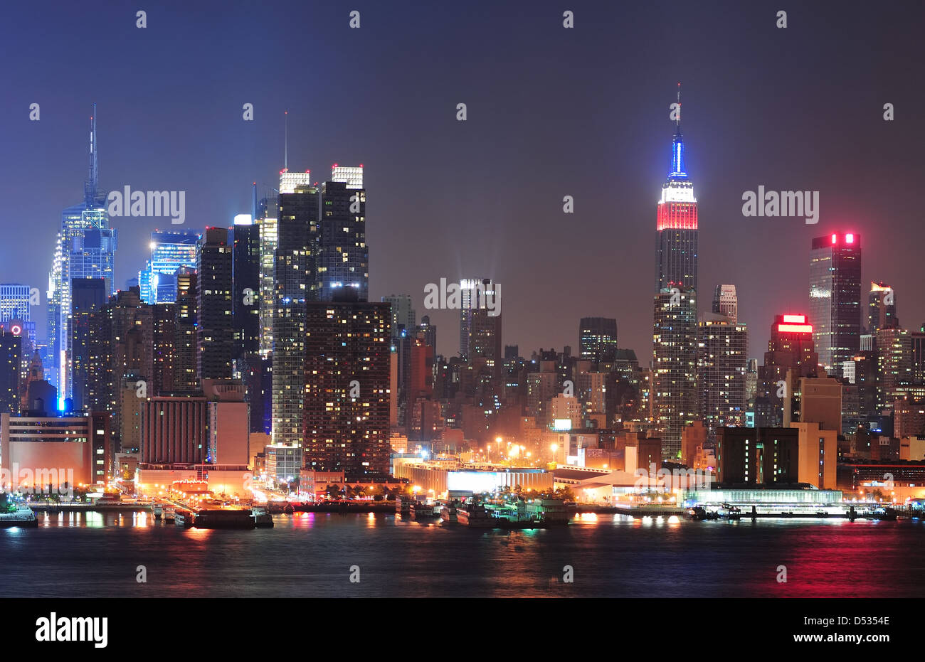 New York City Manhattan midtown skyline at night with skyscrapers lit ...