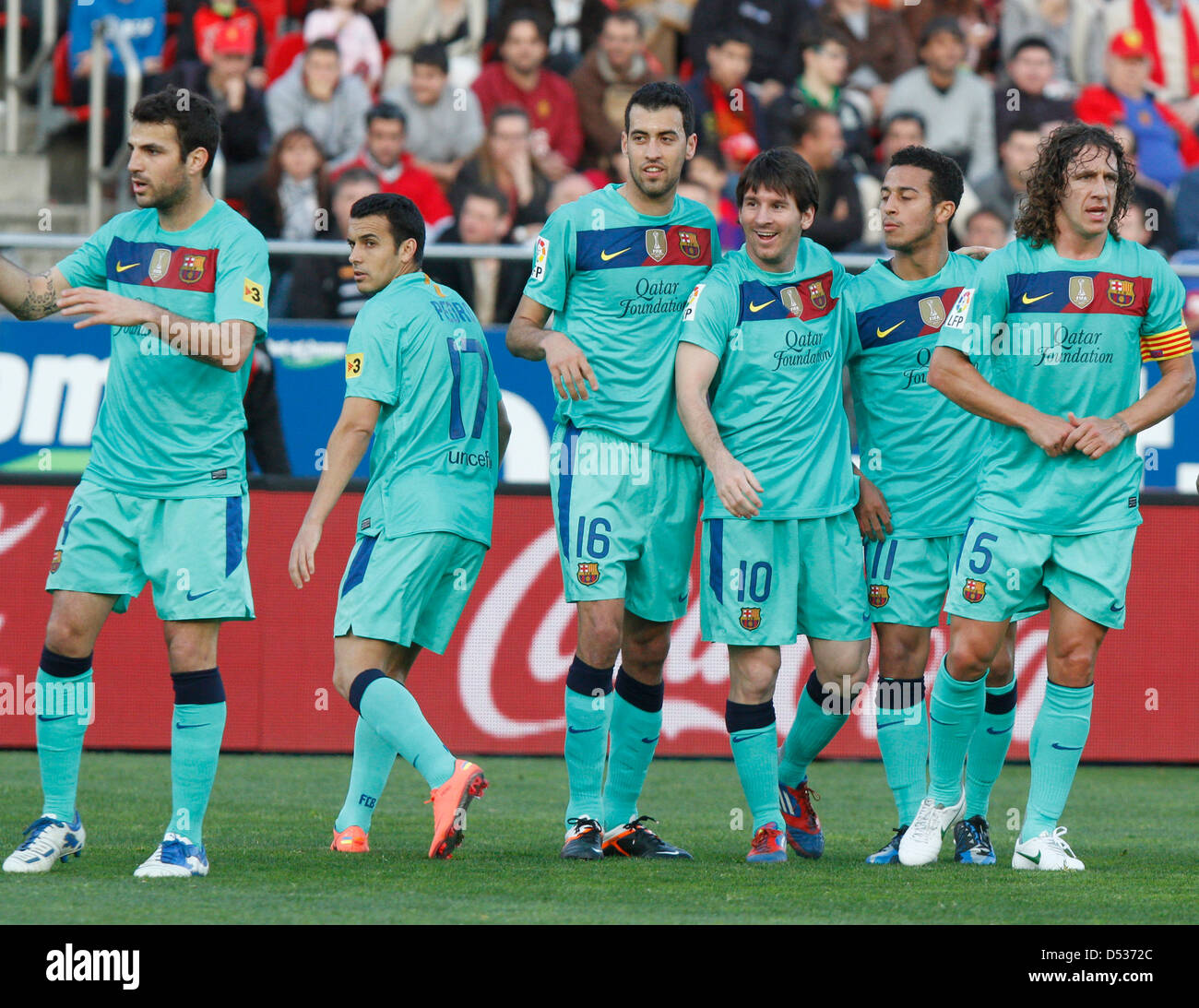 Barcelona´s soccer player Lionel Messi (3rd right) and teammates celebrate after scoring a goal during a match Stock Photo