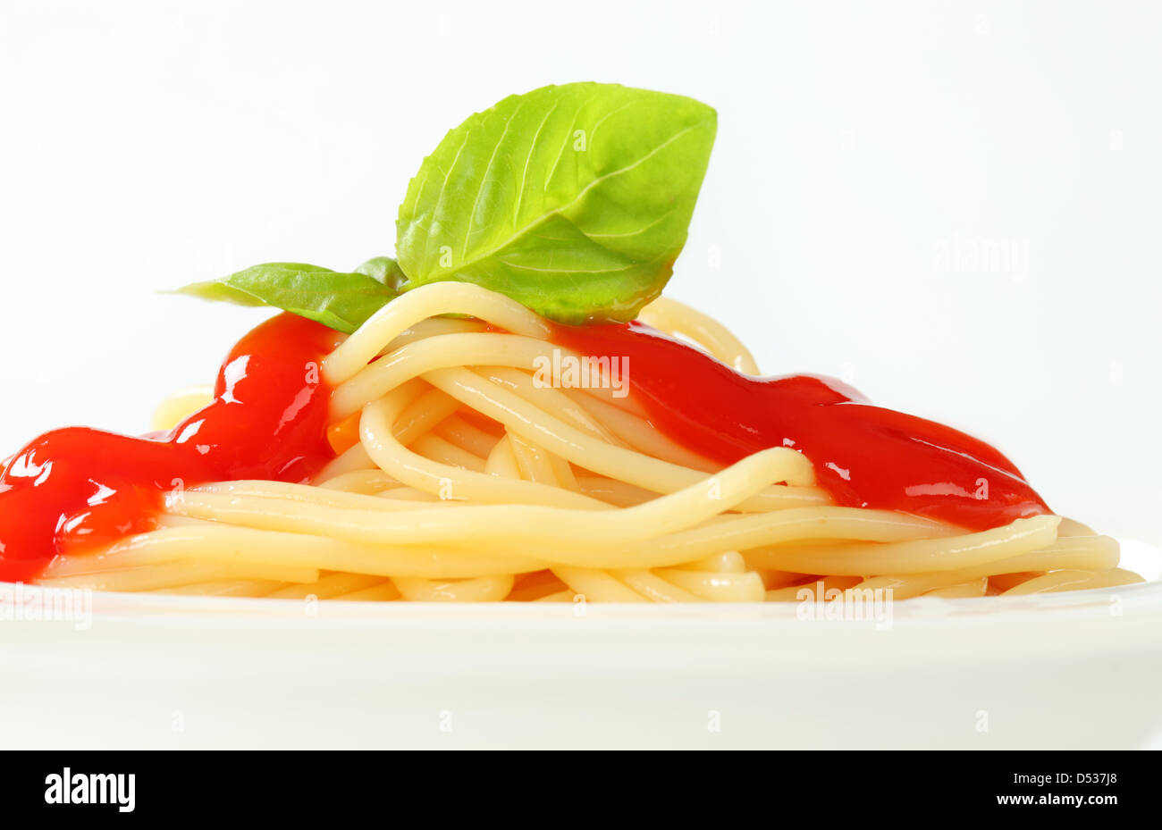 Cooked spaghetti with tomato sauce Stock Photo