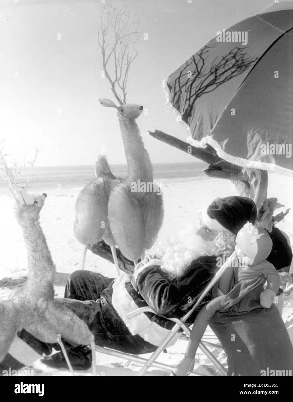 Santa Claus sleeping at the beach Panama City Beach, Florida Stock