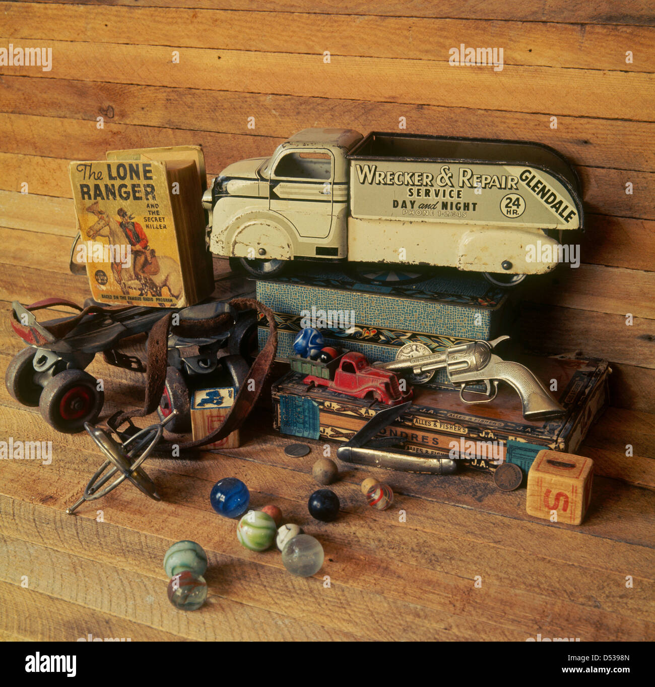 Collection of antique toys, trucks, marbles, roller skates, cap gun and Lone Ranger Big Little Book. Lincoln Nebraska NE USA Stock Photo