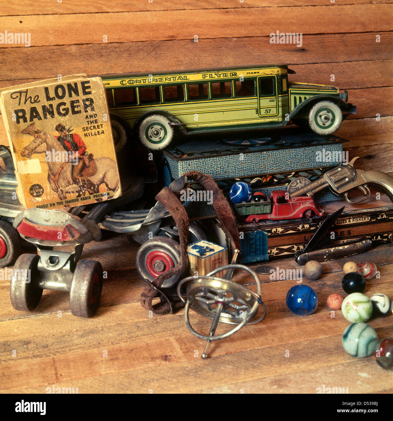 Collection of antique toys, trucks, roller skates, cap gun, gyroscope and Lone Ranger Big Little Book. Lincoln Nebraska NE USA Stock Photo