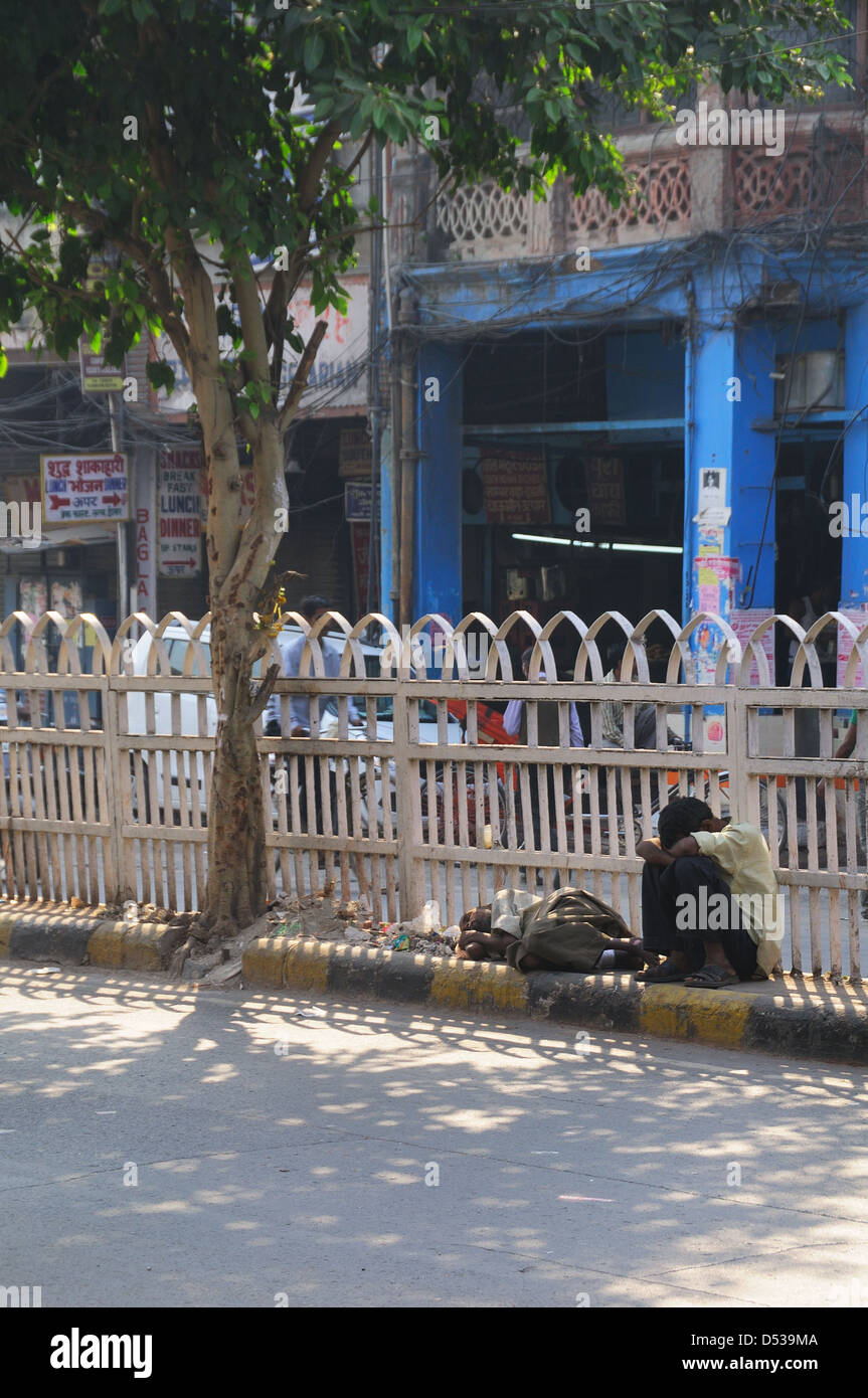 Man sitting by the street early morning in Old Delhi Stock Photo
