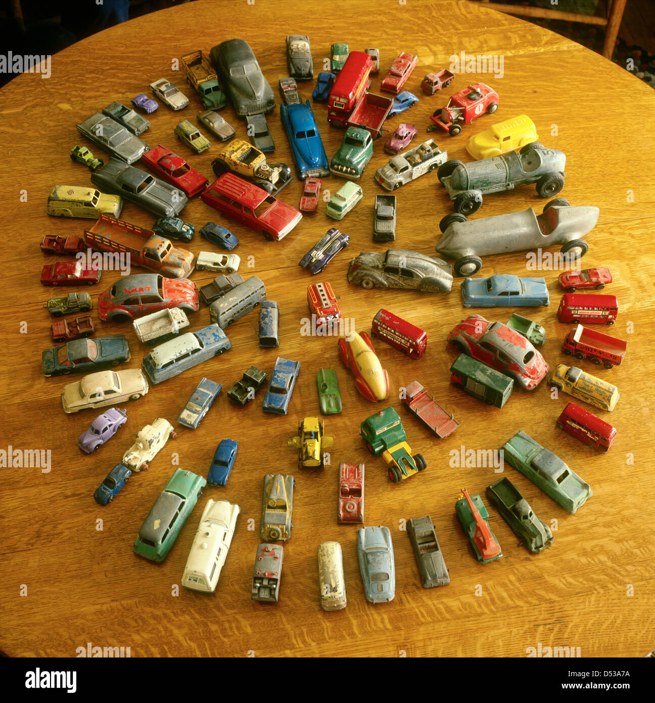 Circles of collectible cars on oak table.  Lincoln Nebraska NE USA Stock Photo