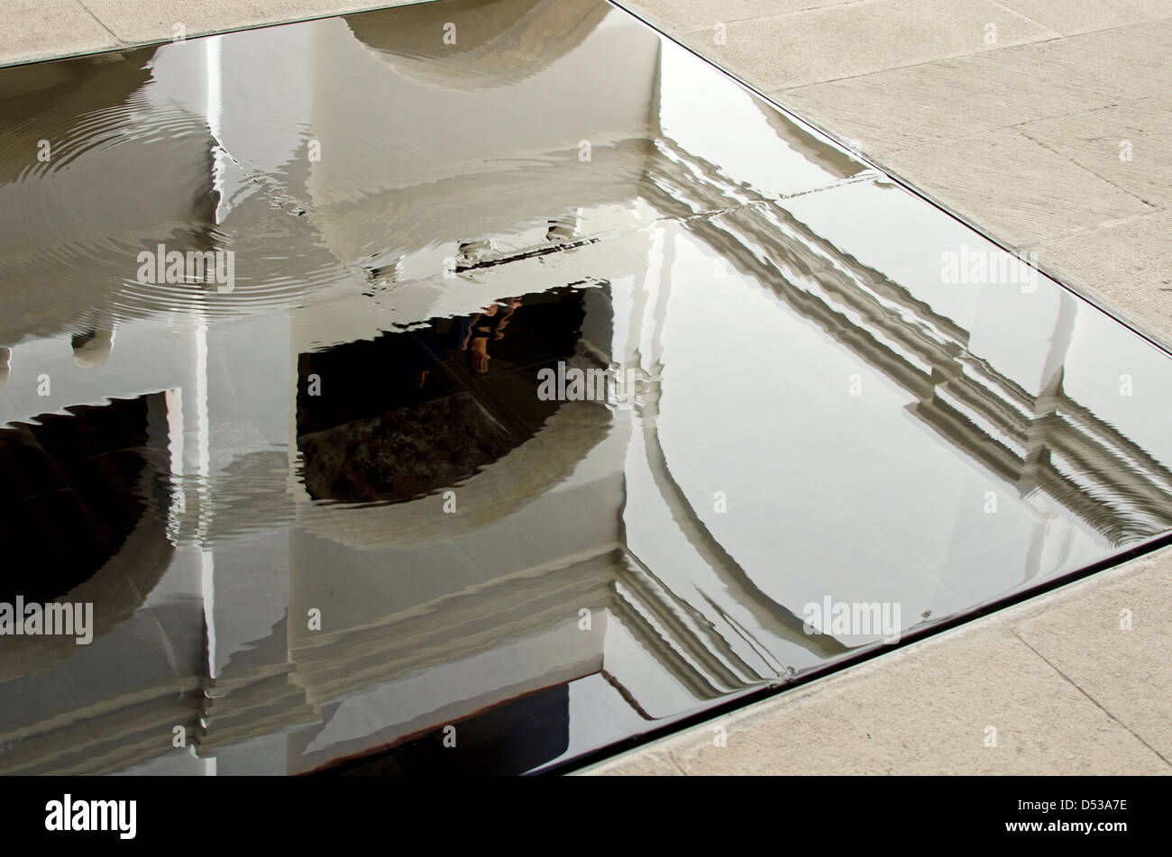 The old convent's white arches are reflected in a shallow pool in the courtyard of the Centro Académico of San Pablo. Stock Photo