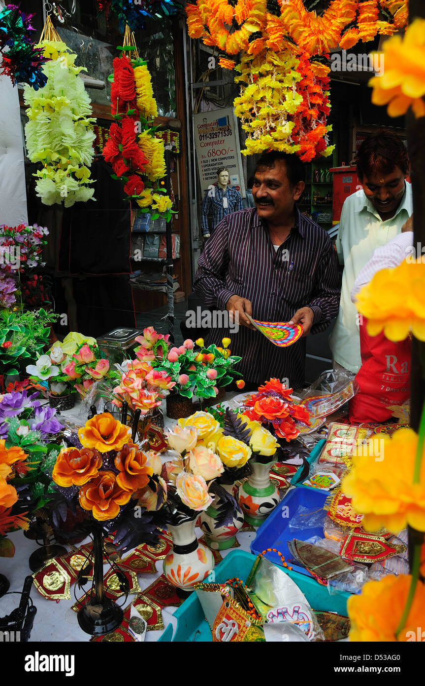 Man selling artificial flowers at the market for Diwali festival Stock Photo