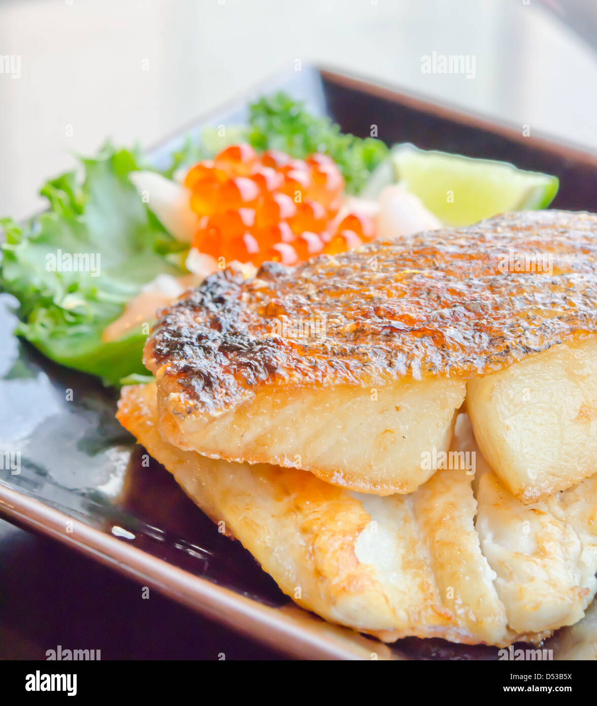 Japanese grilled cod fish and fresh salad with fish egg Stock Photo - Alamy