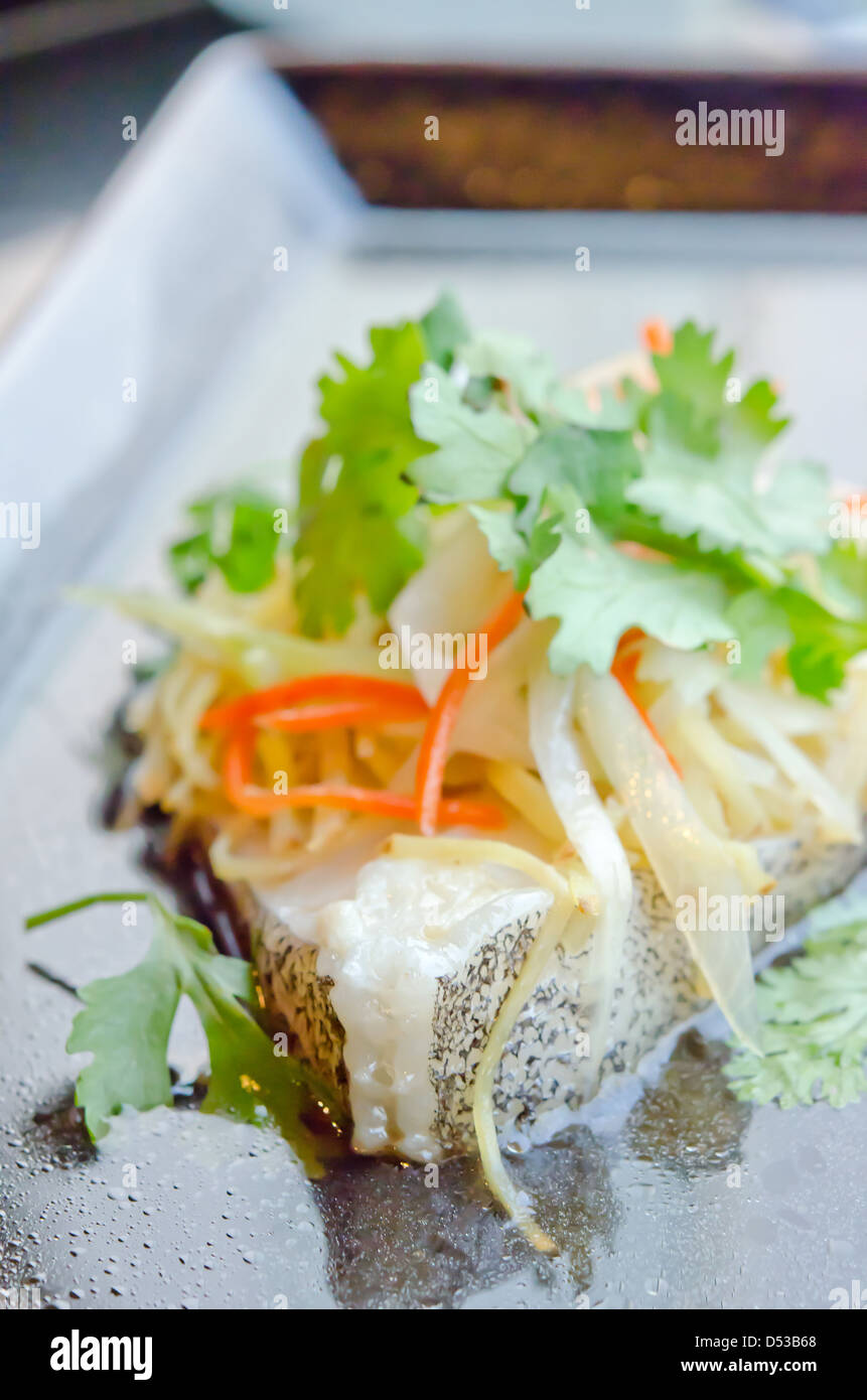 steamed white fish fillet with vegetable on the plate Stock Photo - Alamy