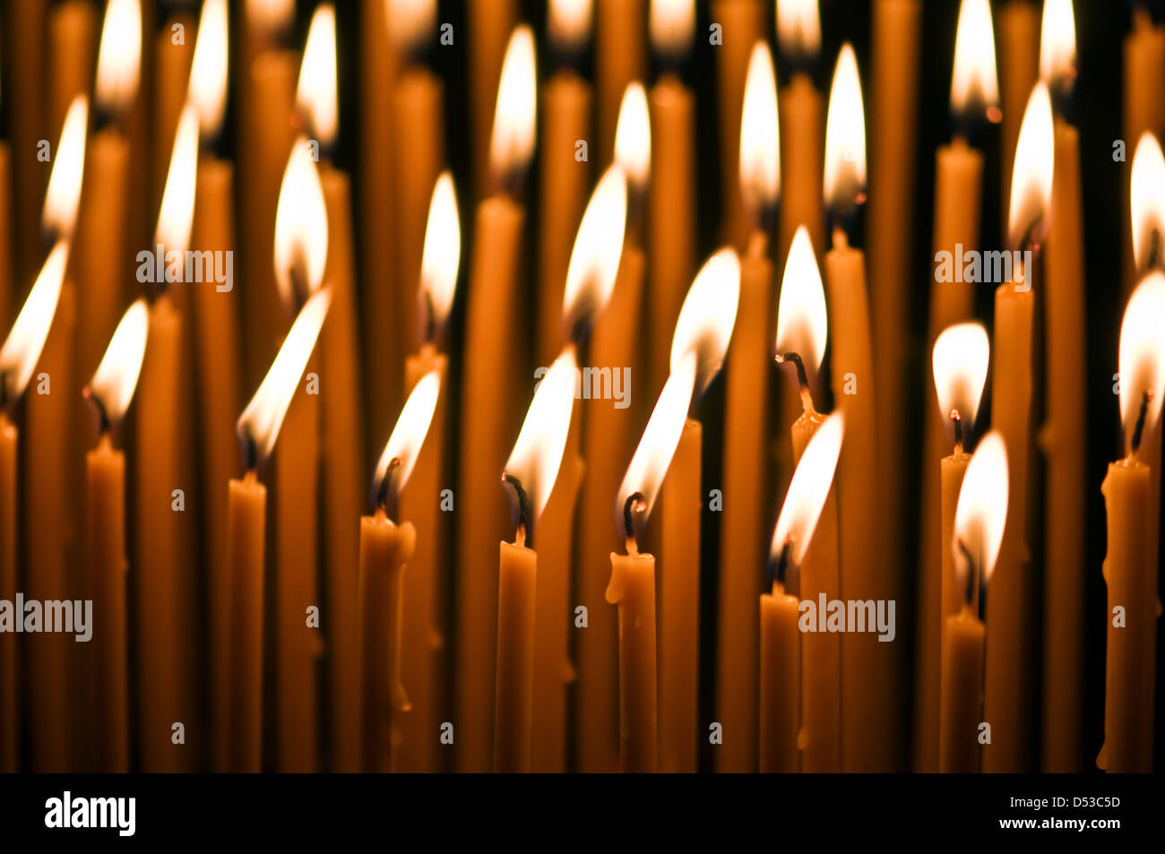 burning orange candles close up Stock Photo Alamy