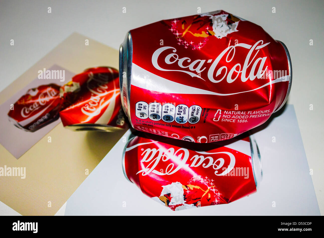 A photo of a coke tin with a photo of the same coke tin with a photo of