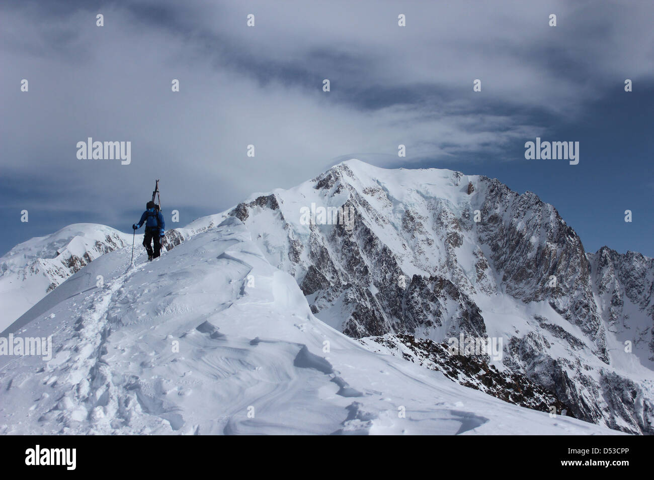 Ski touring ridge of Domes de Miage. Summit of Mont Blanc in background. Stock Photo