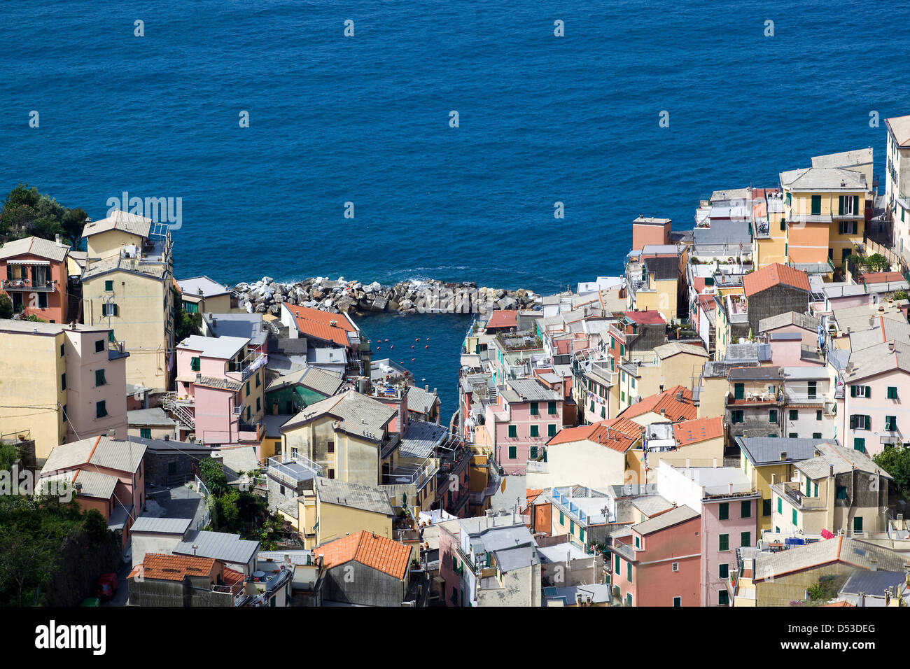 Riomaggiore Village in the Cinque Terre, Italy - Shot taken from the hills above capturing the quaint houses and the seafront Stock Photo