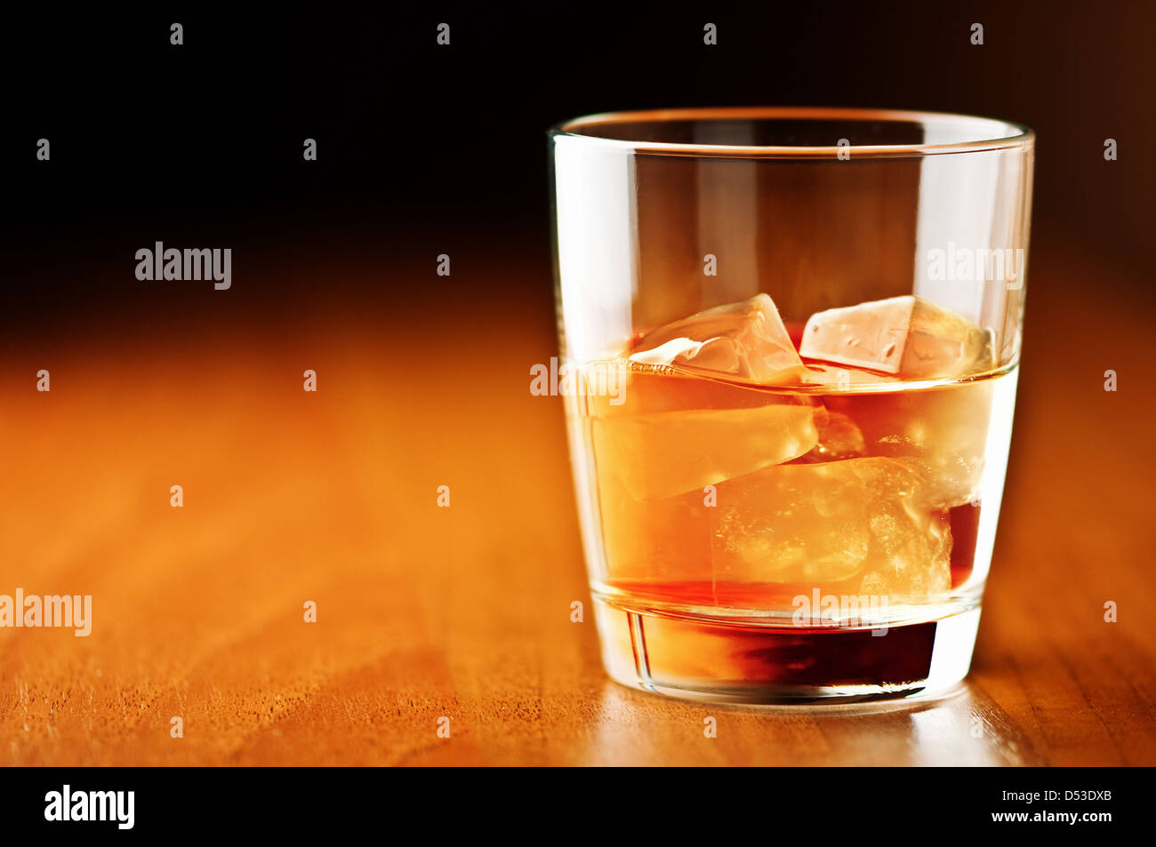 whiskey glass on wooden counter Stock Photo