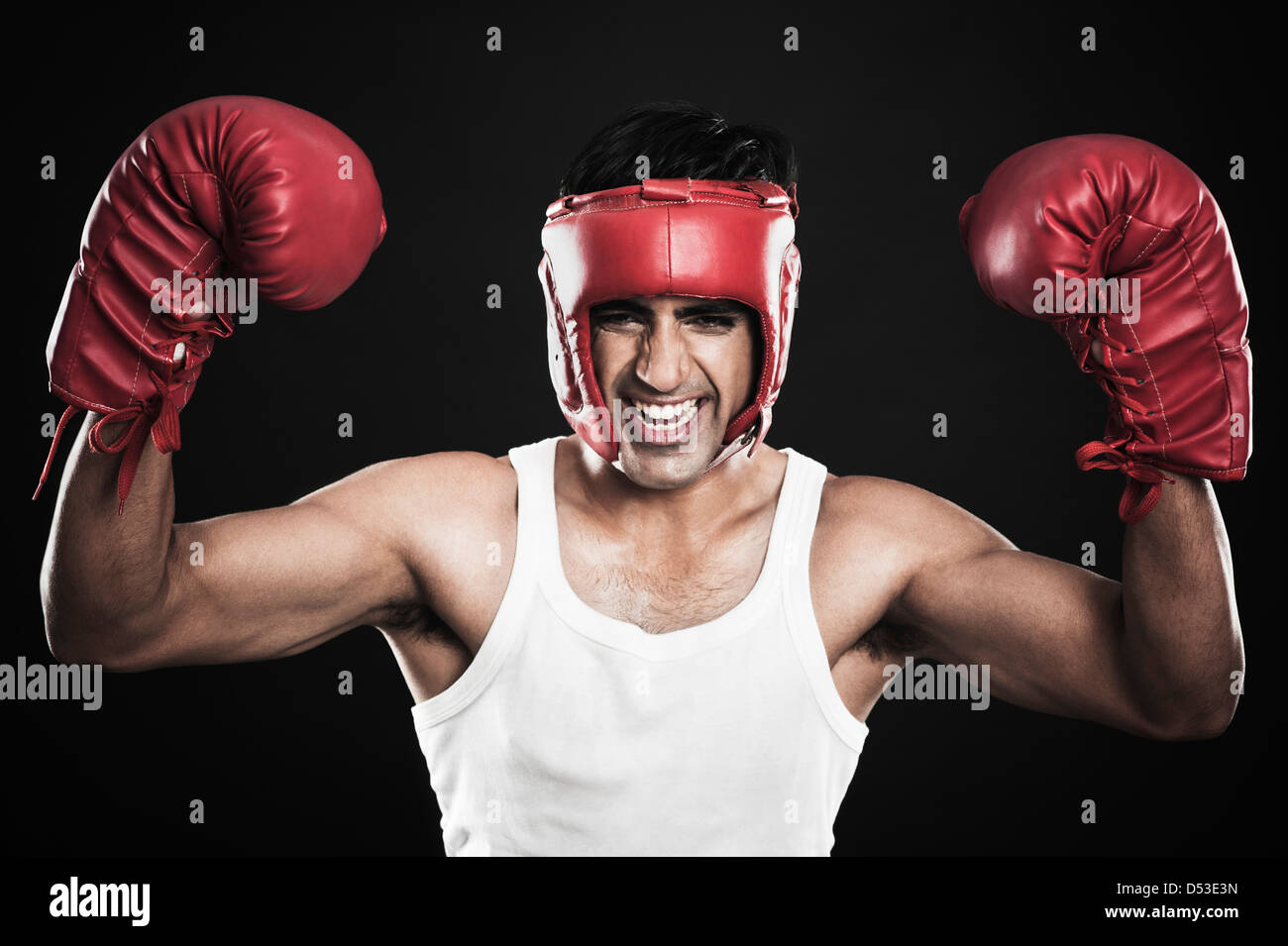 Boxer with arms raised in celebration Stock Photo Alamy