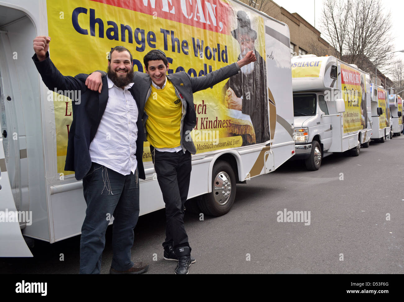 2 Orthodox Jewish men in front of Mitzvah Tanks lined up prior to a parade on the occasion of the Lubavitcher Rebbe's birthday. Stock Photo