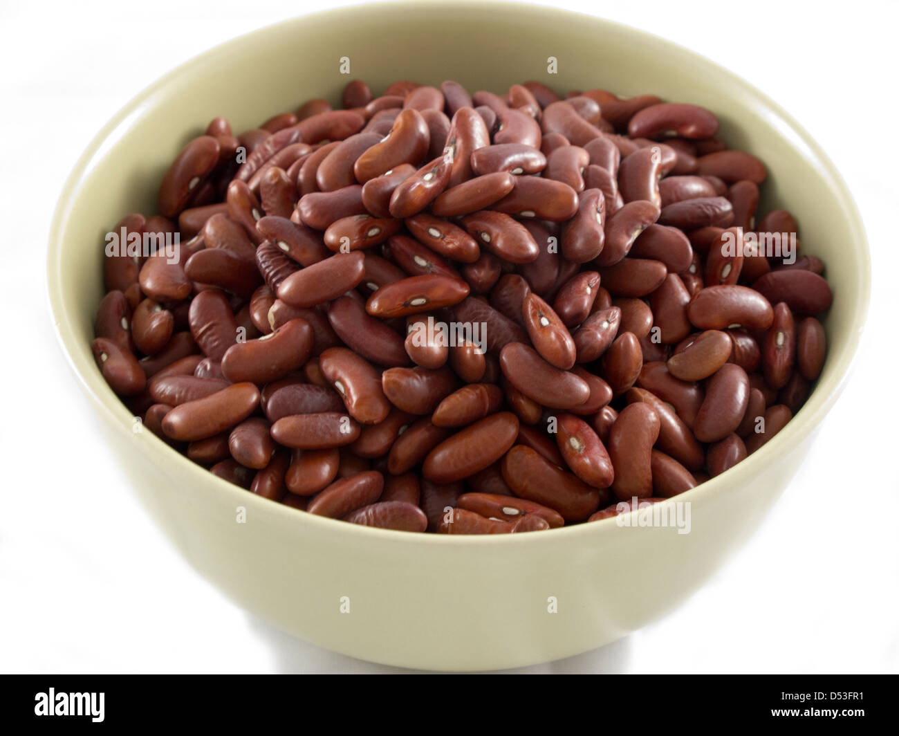 Bowl of dry red kidney beans on white background Stock Photo