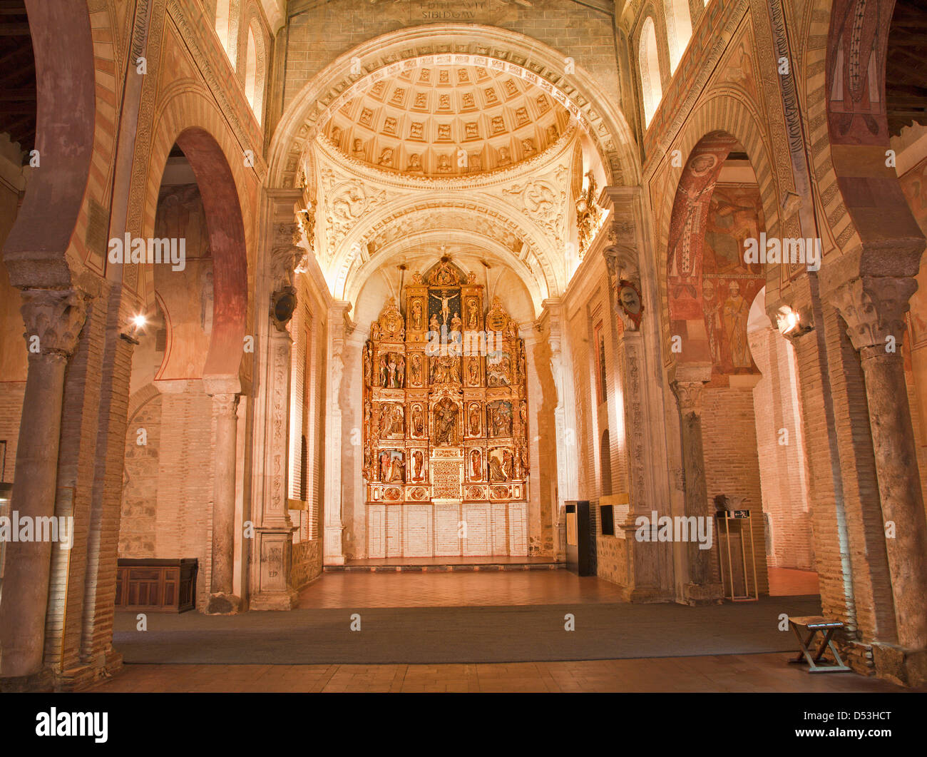 TOLEDO - MARCH 8: Nave and altar of San Roman church has a steeple built in the mudejar architectural style in the 13th cent. Stock Photo